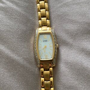 Citizen Gold Tone Women's Watch with White Dial and Crystal Accents.
